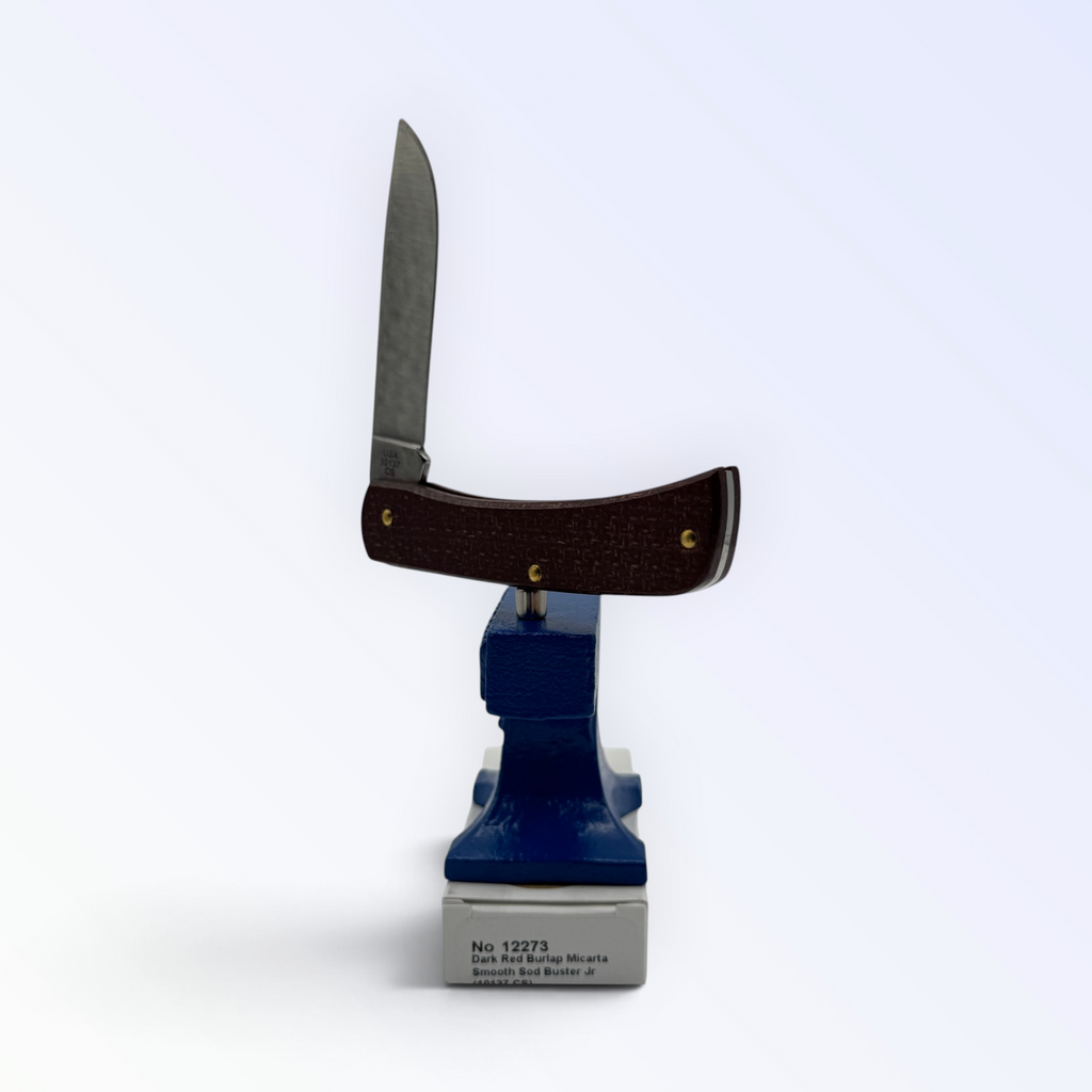 Case XX Sod Buster Jr 12273: dark red burlap Micarta, open on box with end label facing forward