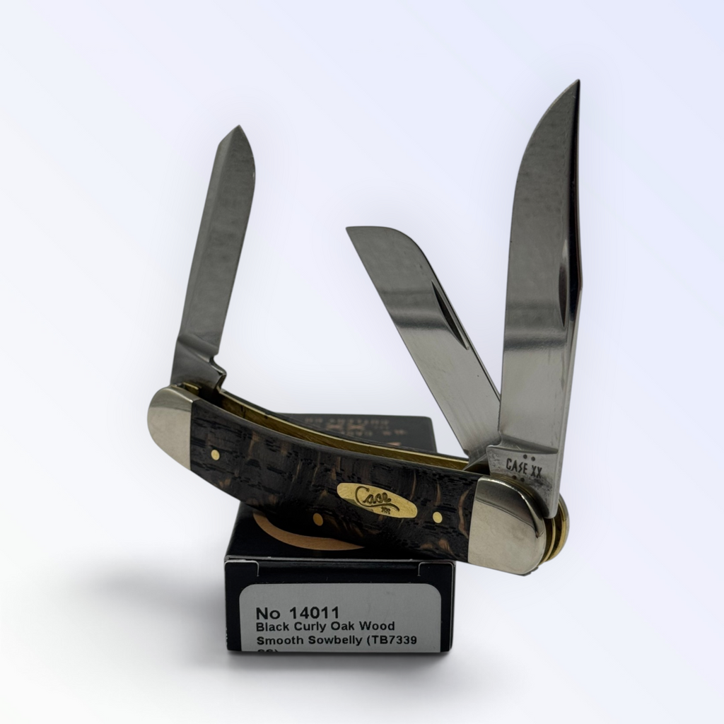 Case XX 14011 Sowbelly Stockman in black curly oak wood — angled open view on Case XX packaging