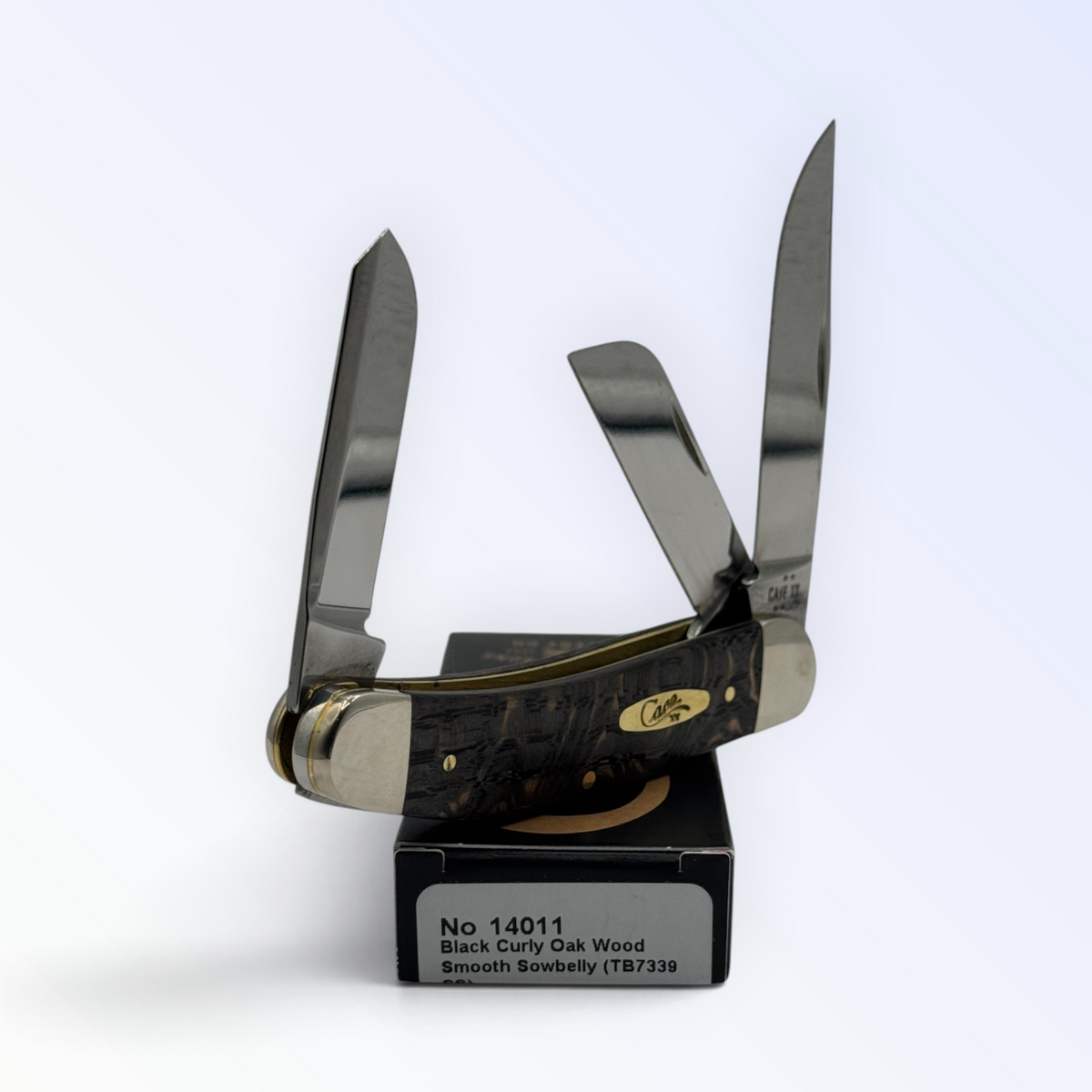 Sowbelly Stockman by Case XX in black curly oak wood (14011), three-quarter open shot showing handle and blades