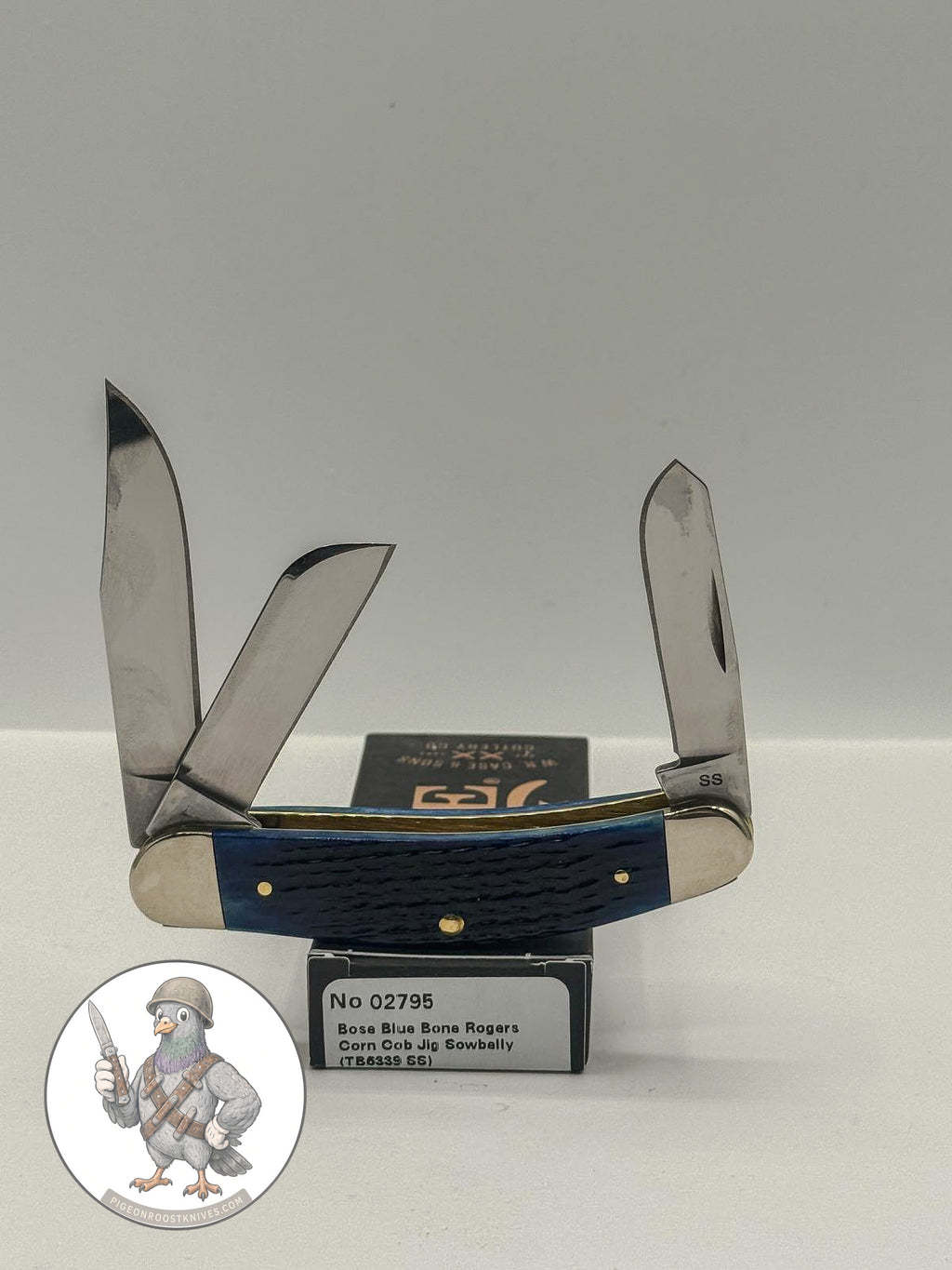 Case XX 02795 Sowbelly Stockman in jigged navy blue bone — angled open view on Case XX packaging
