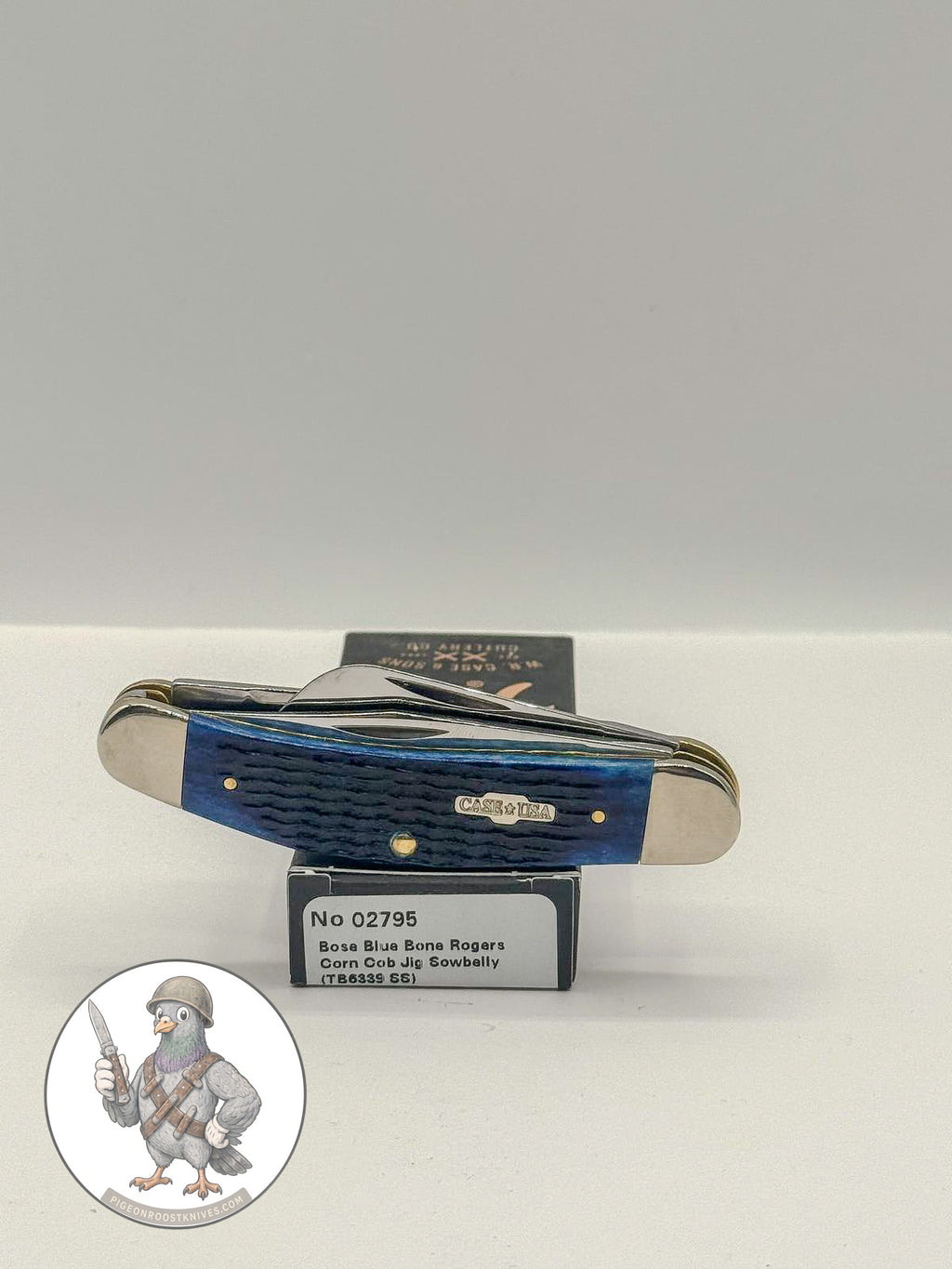 Sowbelly Stockman by Case XX in jigged navy blue bone (02795), open on box with end label facing forward