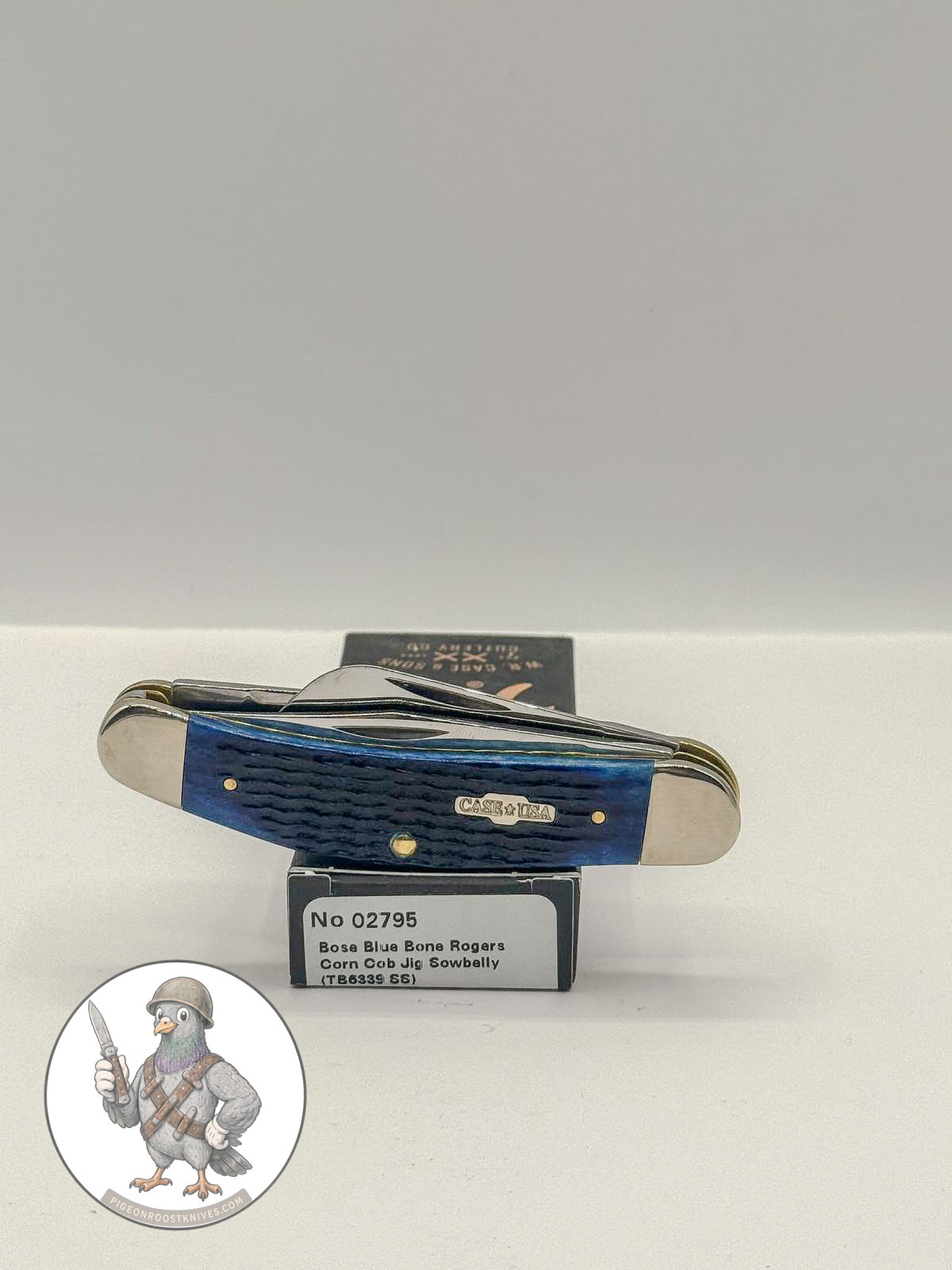 Sowbelly Stockman by Case XX in jigged navy blue bone (02795), open on box with end label facing forward
