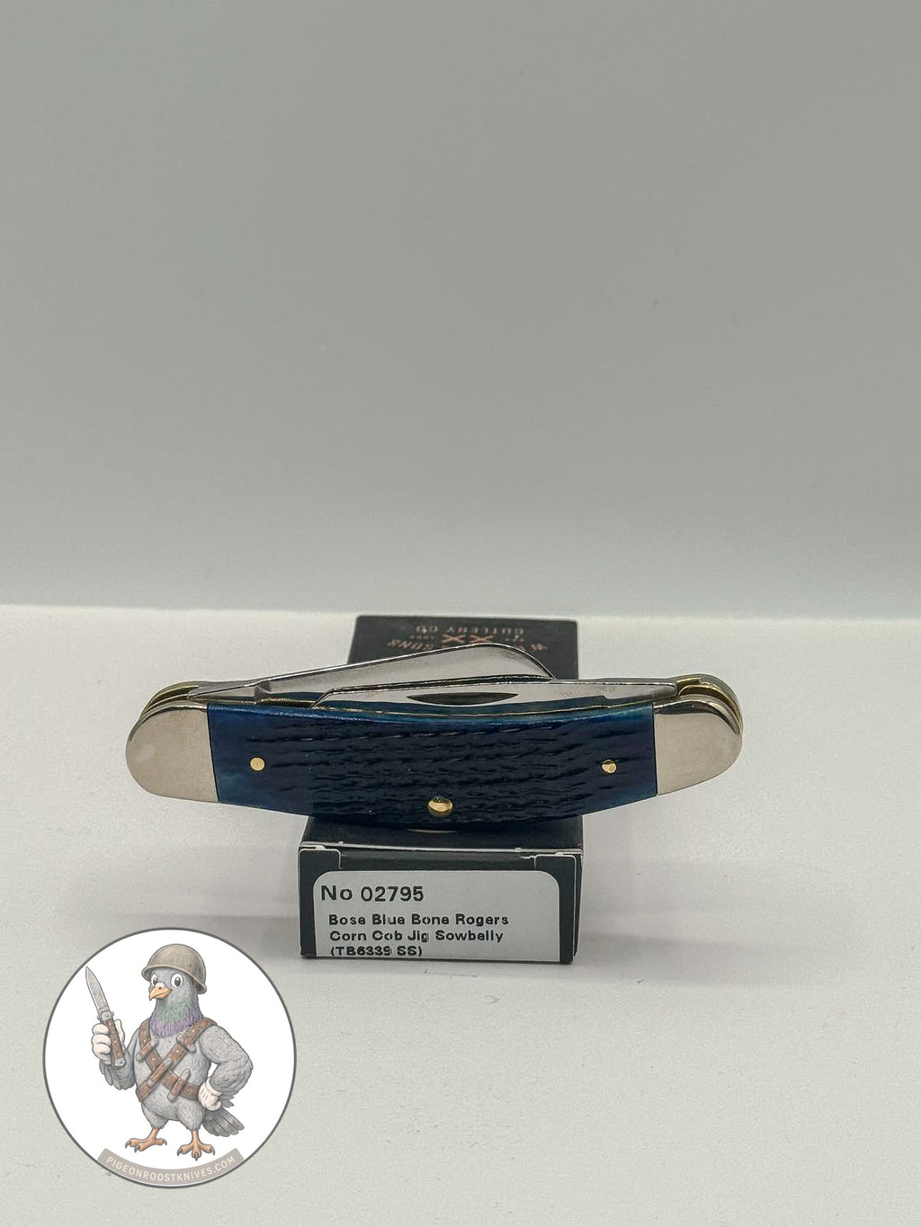 Case XX Sowbelly Stockman 02795: jigged navy blue bone, studio shot open atop the retail box