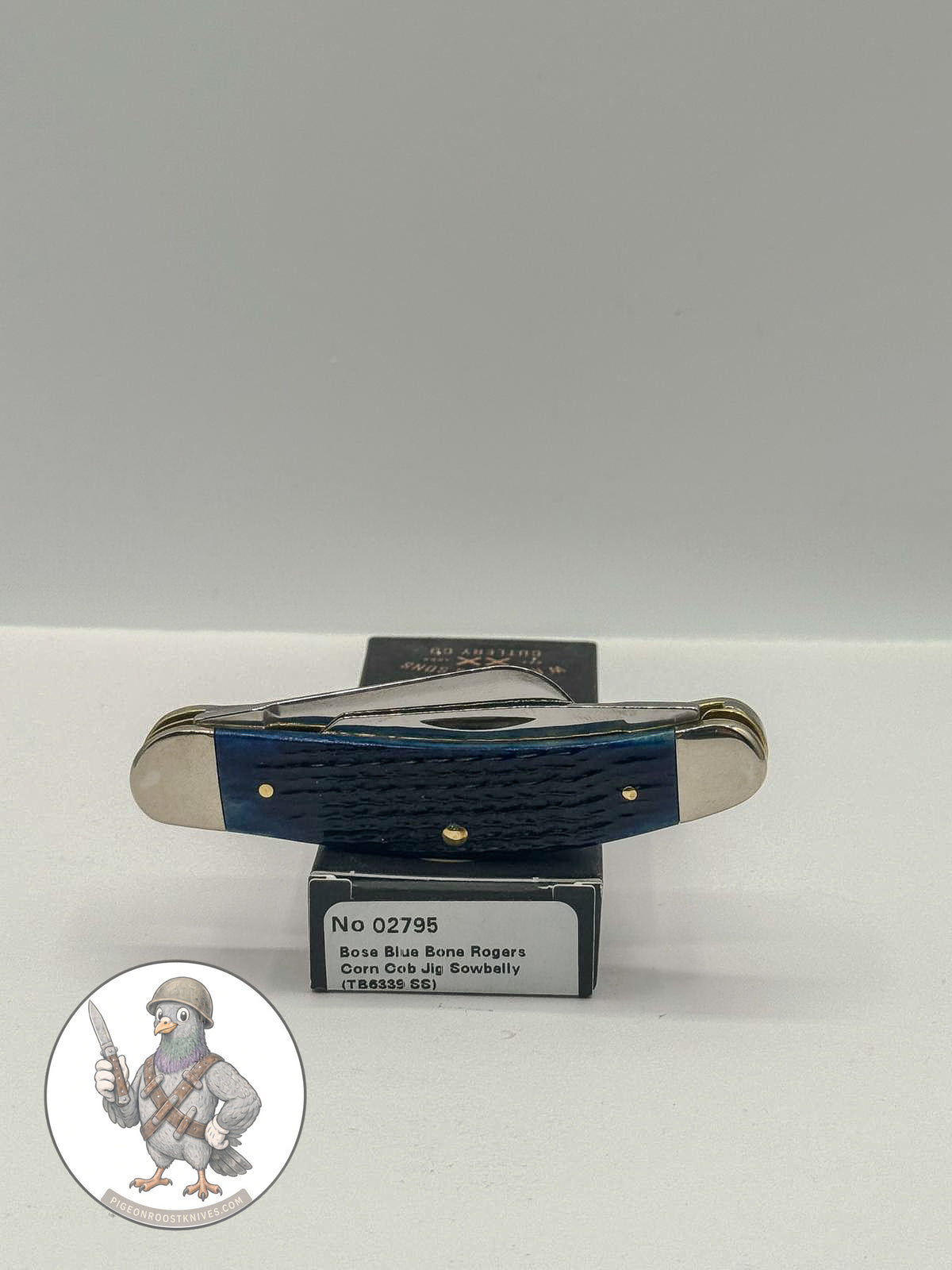 Case XX Sowbelly Stockman 02795: jigged navy blue bone, studio shot open atop the retail box