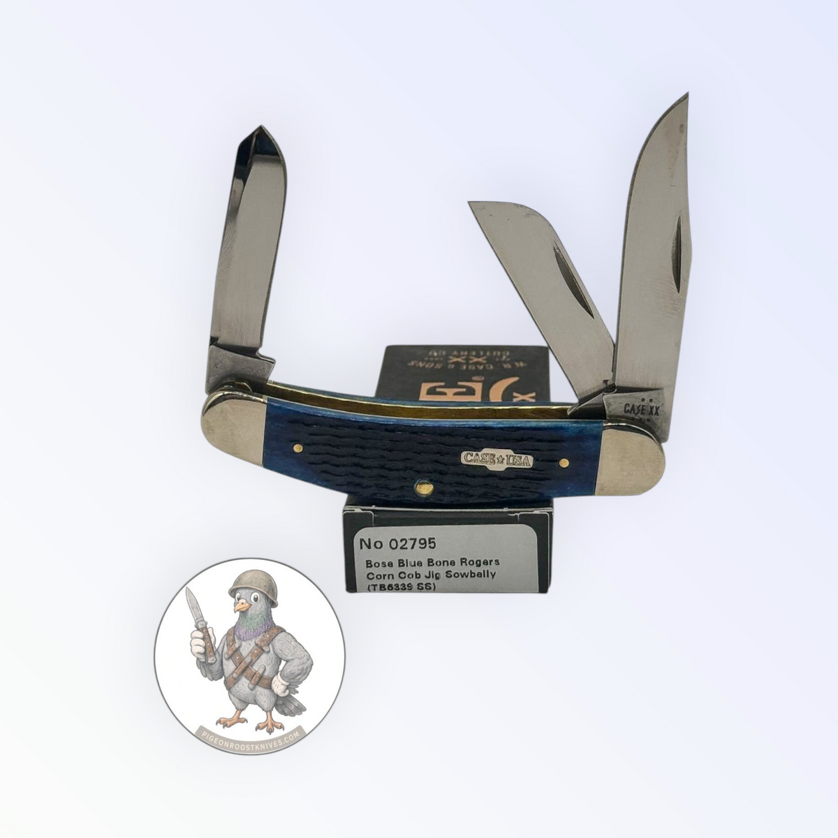 Case XX Sowbelly Stockman with jigged navy blue bone and three-blade stockman, SKU 02795 — blades open resting on the factory box