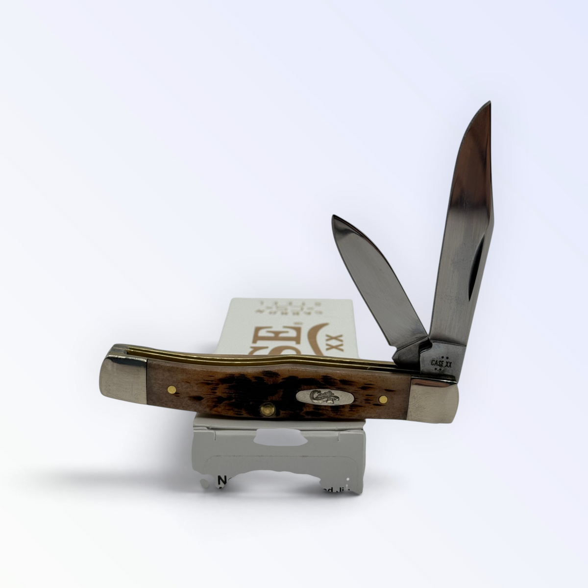 Pigeon Roost Knives Case XX Texas Jack pocket knife with amber bone handle and two open carbon steel blades 00077