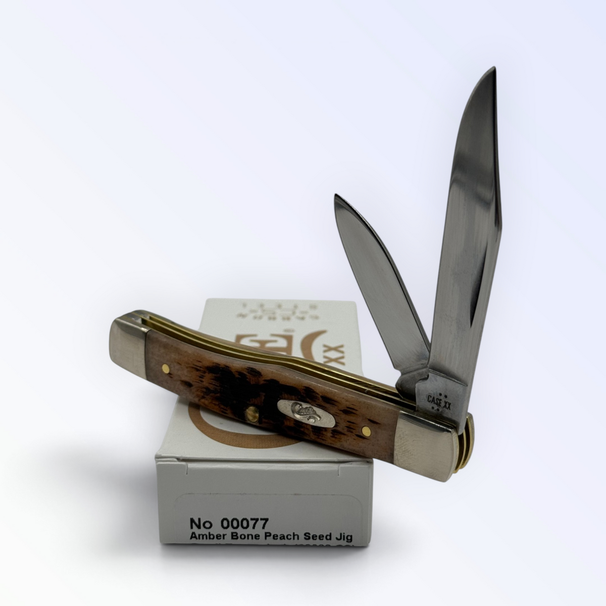 Pigeon Roost Knives Case XX Texas Jack pocket knife with amber peach seed jigged bone handle and two carbon steel blades
