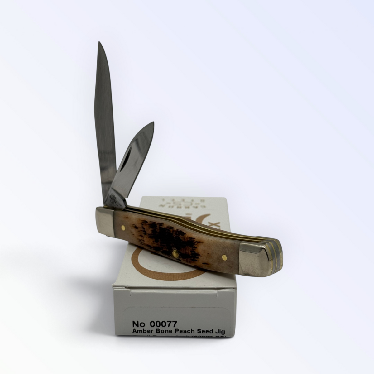 Pigeon Roost Knives Case XX Texas Jack pocket knife with amber peach seed jigged bone handle and two carbon steel blades
