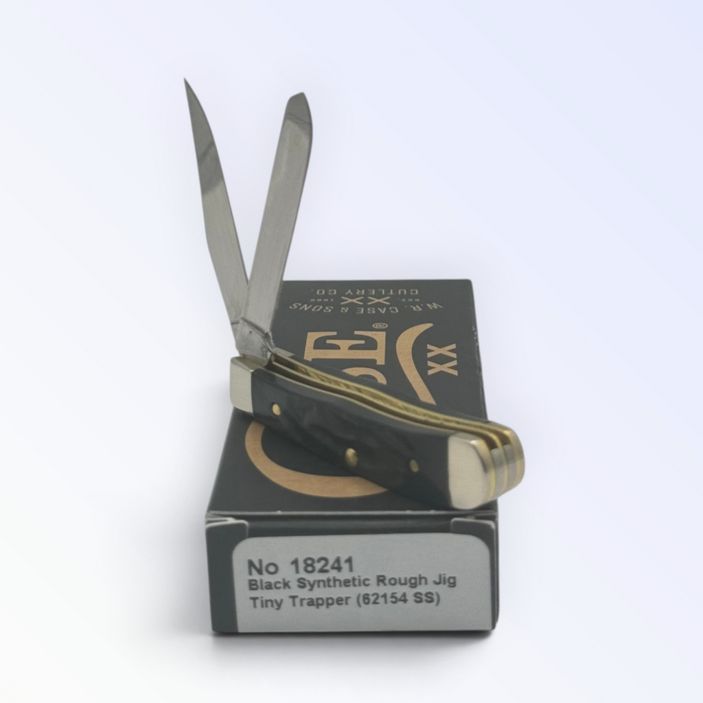 Catalog 18241 Case XX Tiny Trapper Rough Black Synthetic — open blades resting on factory packaging