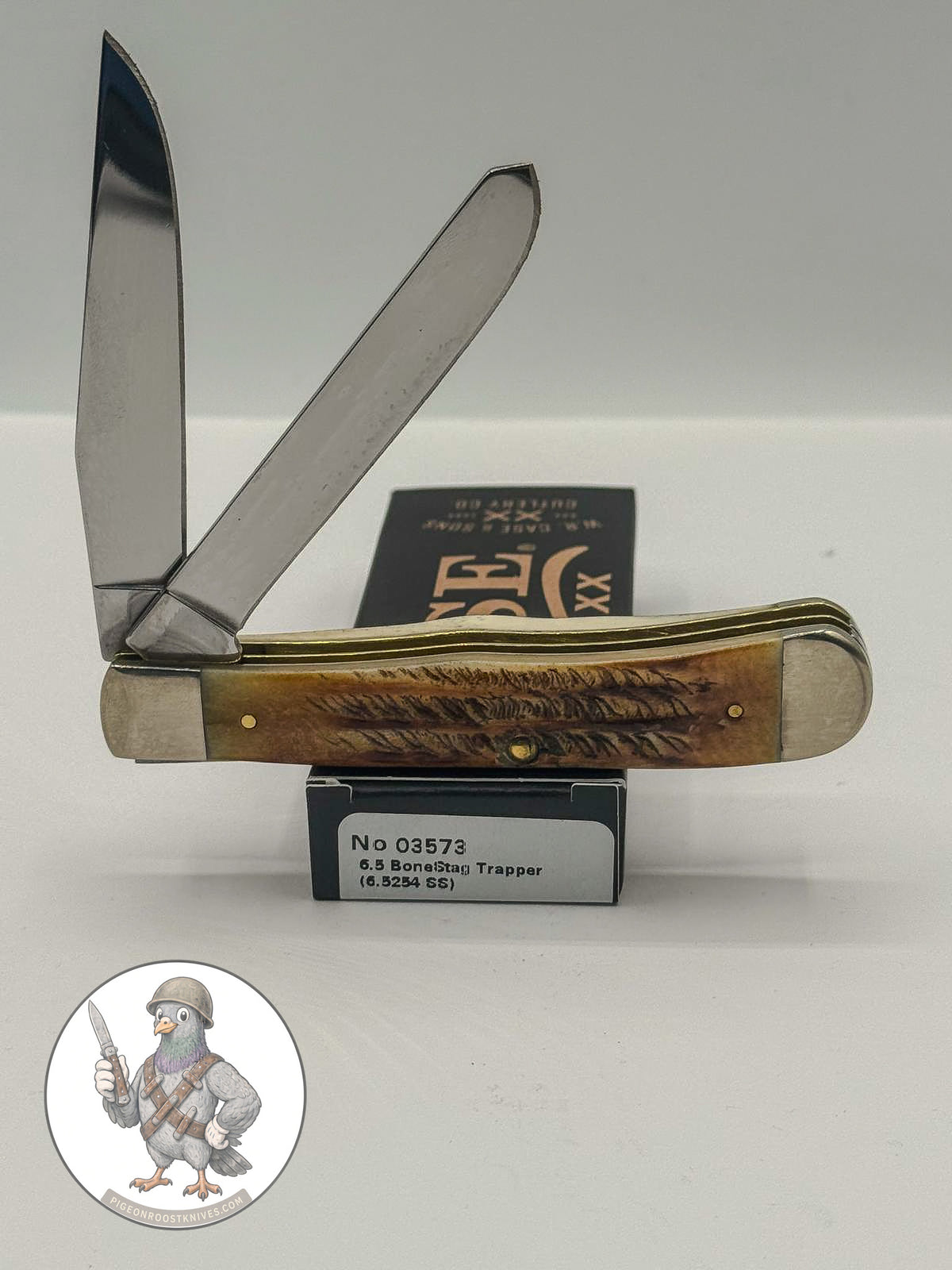 Case XX 03573 6.5 BoneStag Trapper in BoneStag handles — angled open view on Case XX packaging
