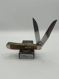 Case XX Trapper with 6.5 Bonestag with Wharncliffe, SKU 65329 — closed profile on the Case XX box