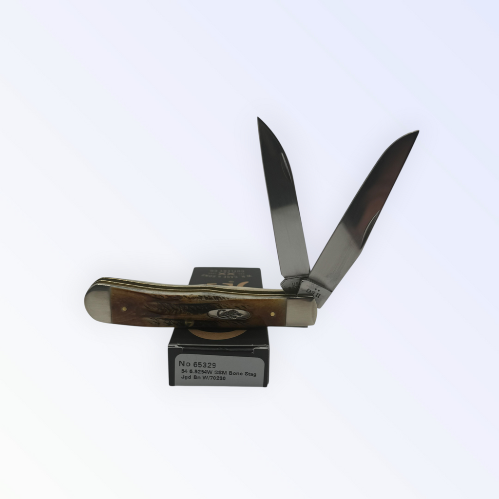 Case XX Trapper with 6.5 Bonestag with Wharncliffe, SKU 65329 — closed profile on the Case XX box