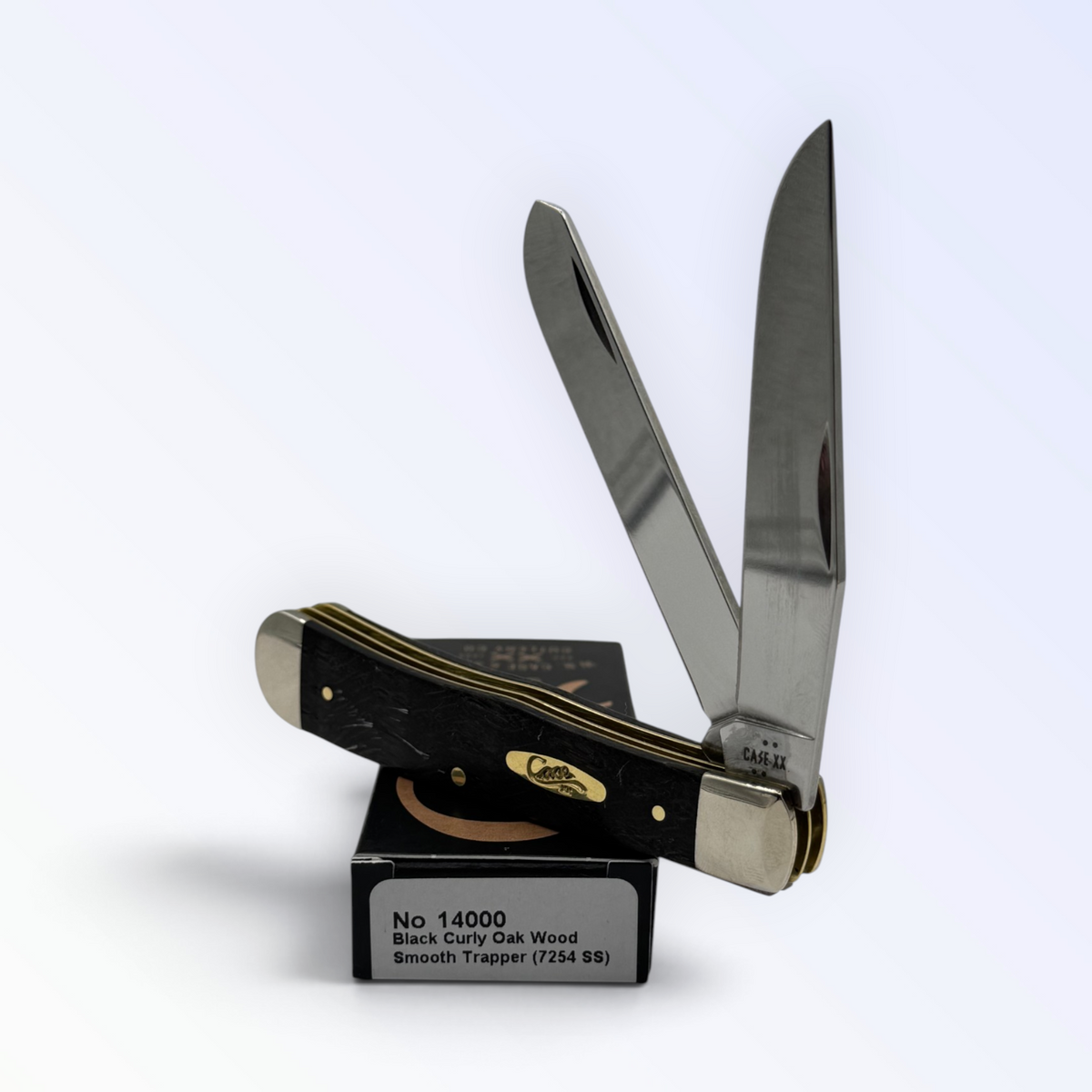 Case XX 14000 Trapper in black curly oak wood — angled open view on Case XX packaging