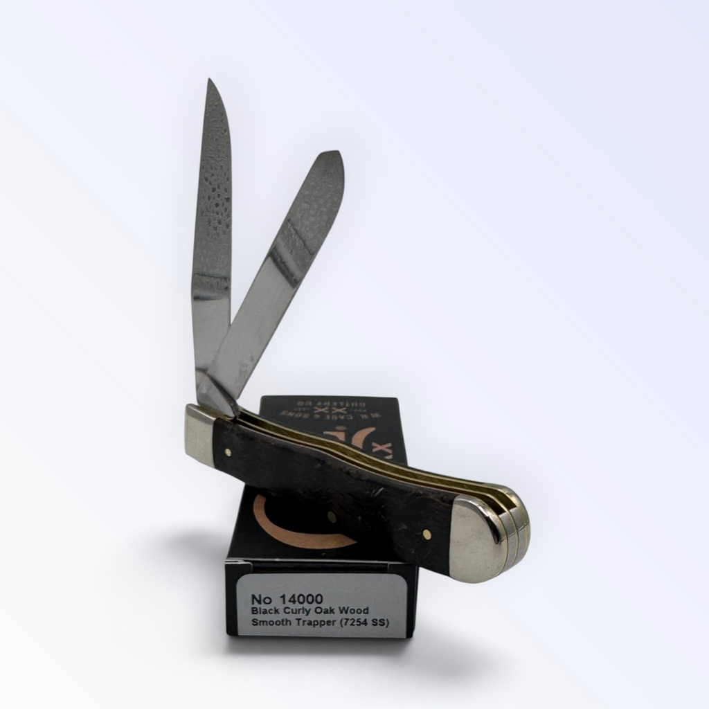 Case XX Trapper 14000: black curly oak wood, open on box with end label facing forward