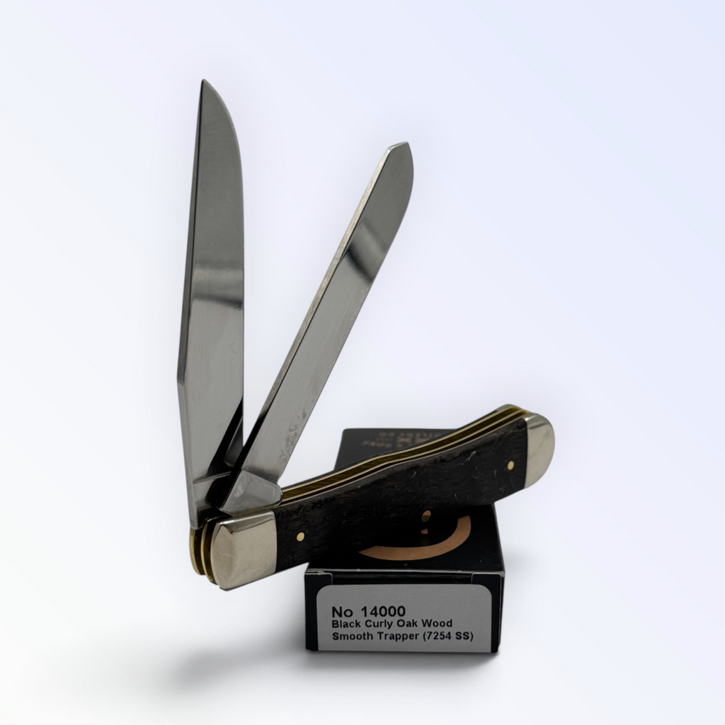 Catalog 14000 Case XX Trapper — black curly oak wood, close view of handle texture with blades open on box