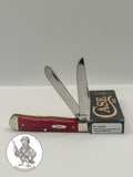 Case XX 00646 Trapper in Dark Red Jigged Bone 6254 SS — open blades resting on factory packaging