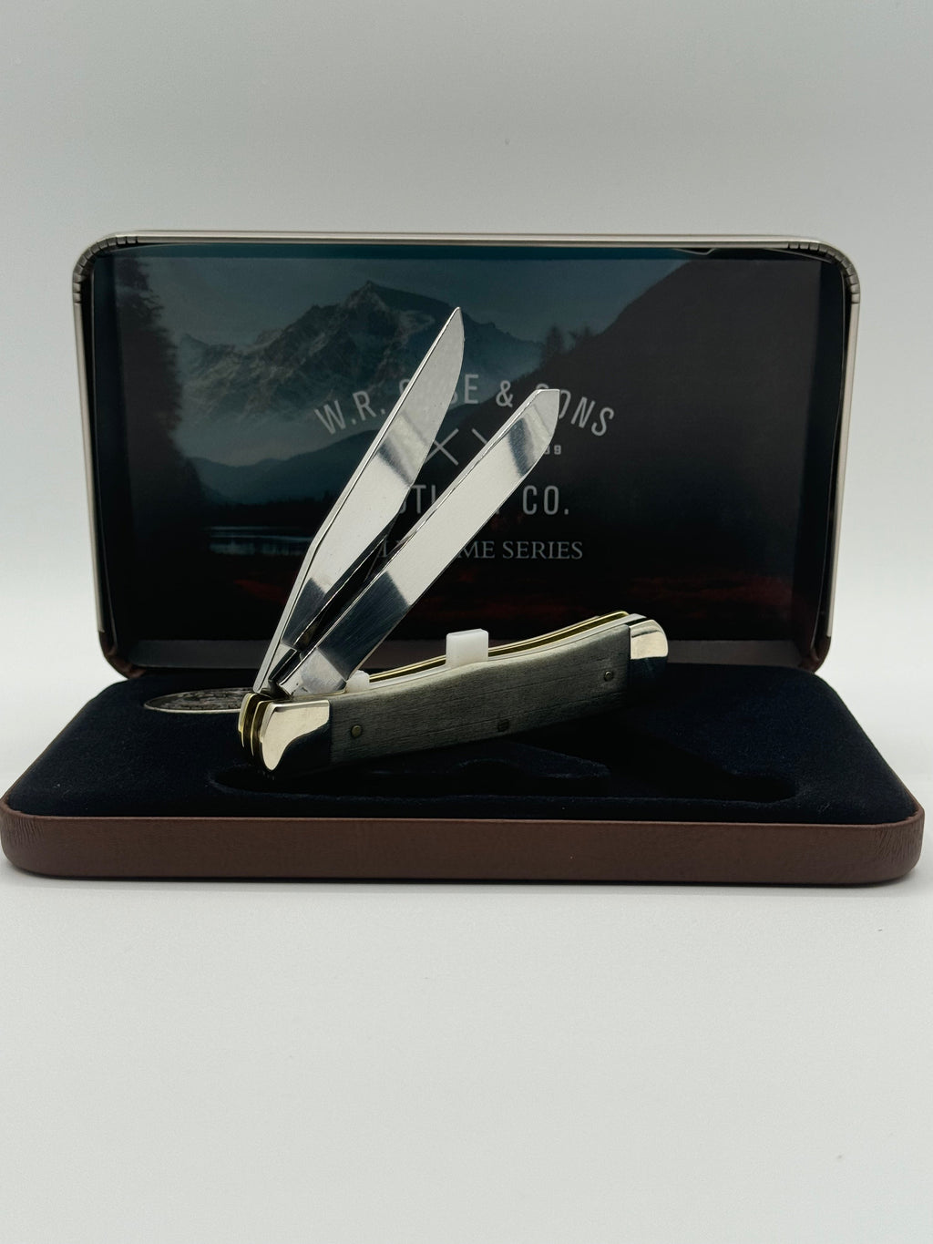 Pigeon Roost Knives Case XX Wild Game Series Trapper knife with smooth bone handle and stainless steel blades in a tin