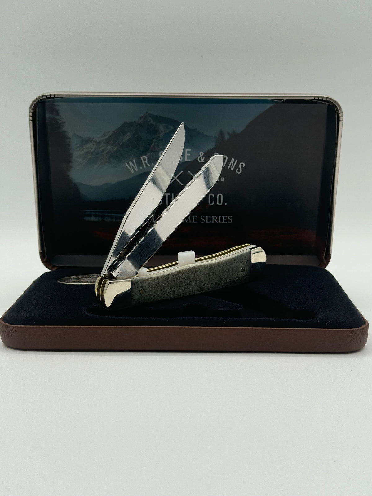 Pigeon Roost Knives Case XX Wild Game Series Trapper knife with smooth bone handle and stainless steel blades in a tin