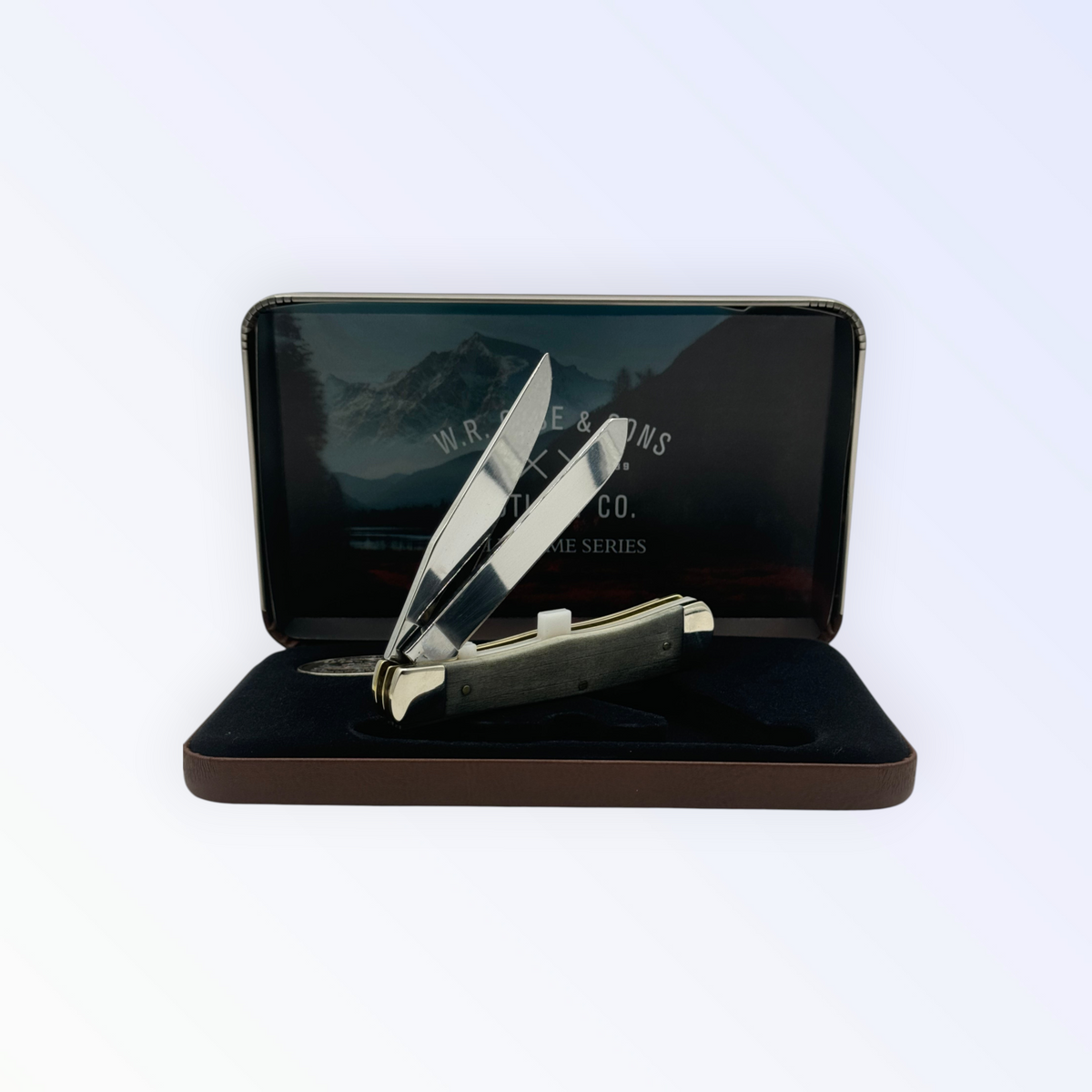 Pigeon Roost Knives Case XX Wild Game Series Trapper knife with smooth bone handle and stainless steel blades in a tin