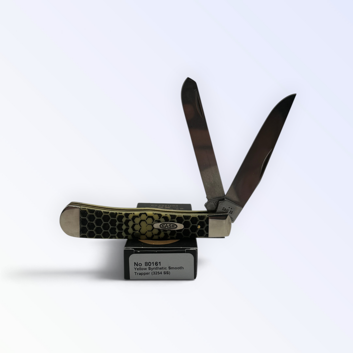 Case XX Trapper 80161HC: Honey Comb Smooth Yellow Synthetic, angled view showing handle texture and bolsters