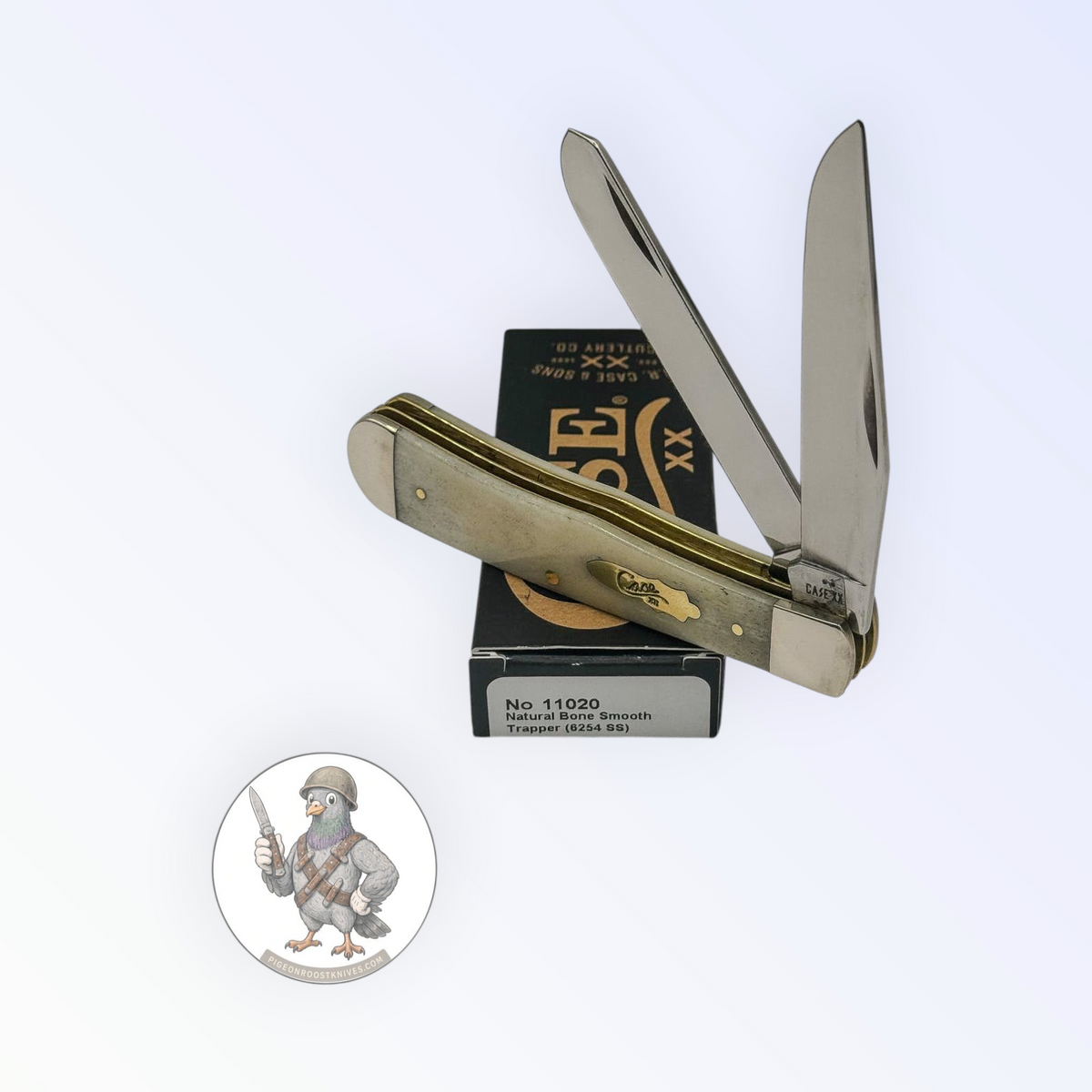 Case XX Trapper 11020: smooth natural bone with brass shield, studio shot open atop the retail box