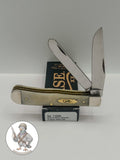 Case XX Trapper with smooth natural bone with brass shield and clip and spey blades, SKU 11020 — blades open resting on the factory box