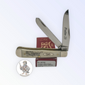 Case XX Trapper with Psalm 23 smooth natural bone and religious saying etched blades, SKU 08795 — blades open resting on the factory box
