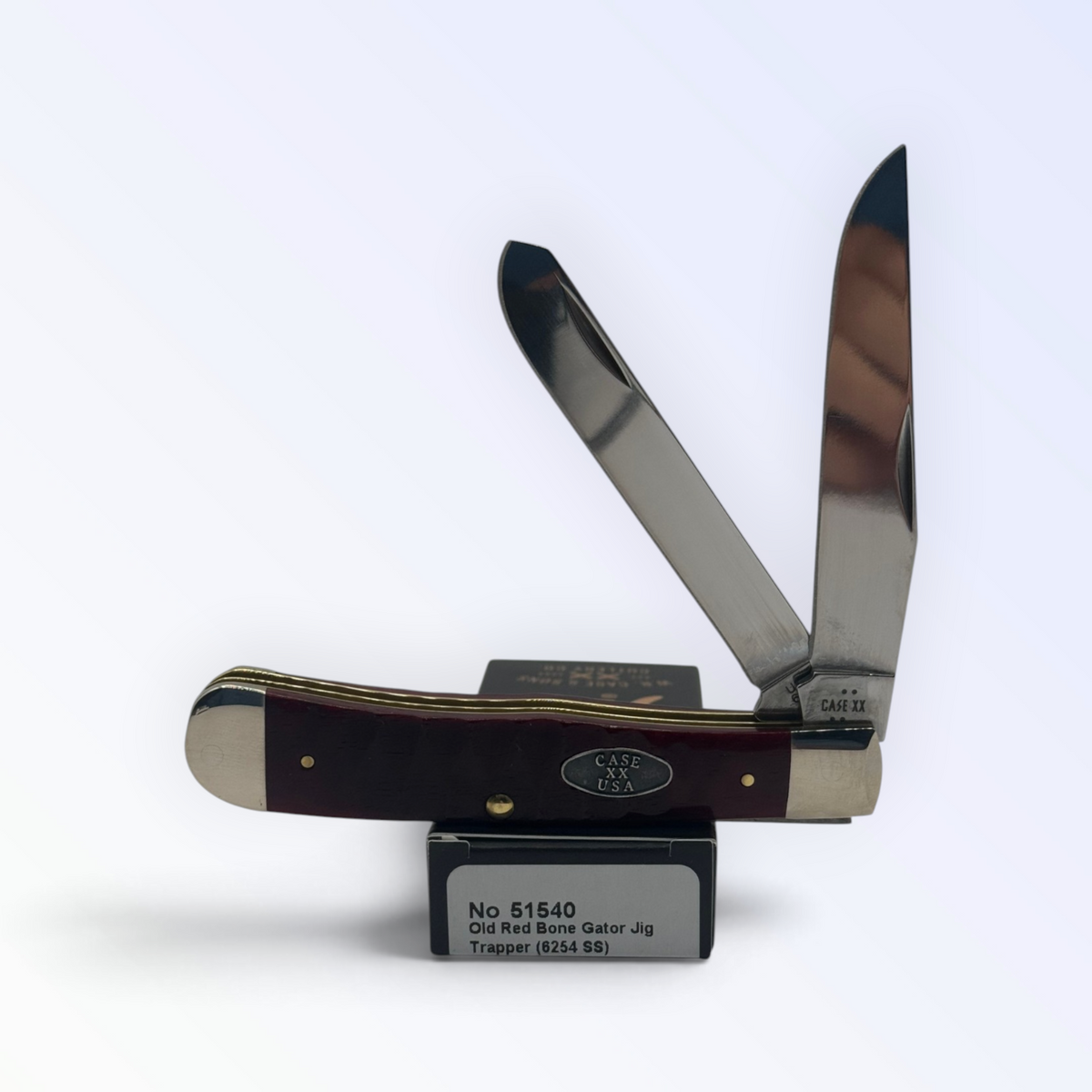 Case XX Trapper (51540) with Red Bone Gator Jig; classic closed side profile on packaging
