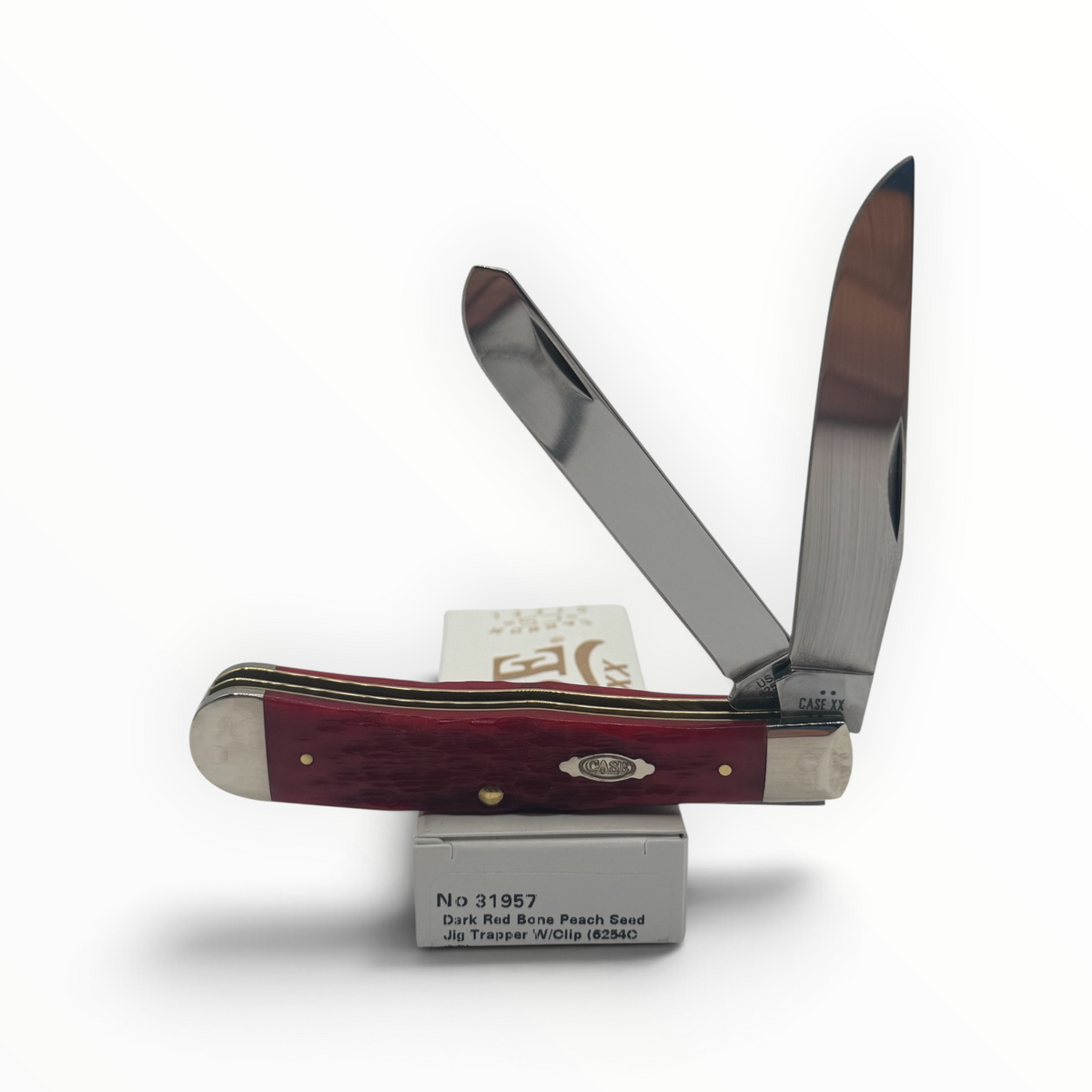 Pigeon Roost Knives Case XX Trapper pocket knife with dark red peach seed jigged bone handle and two carbon steel blades