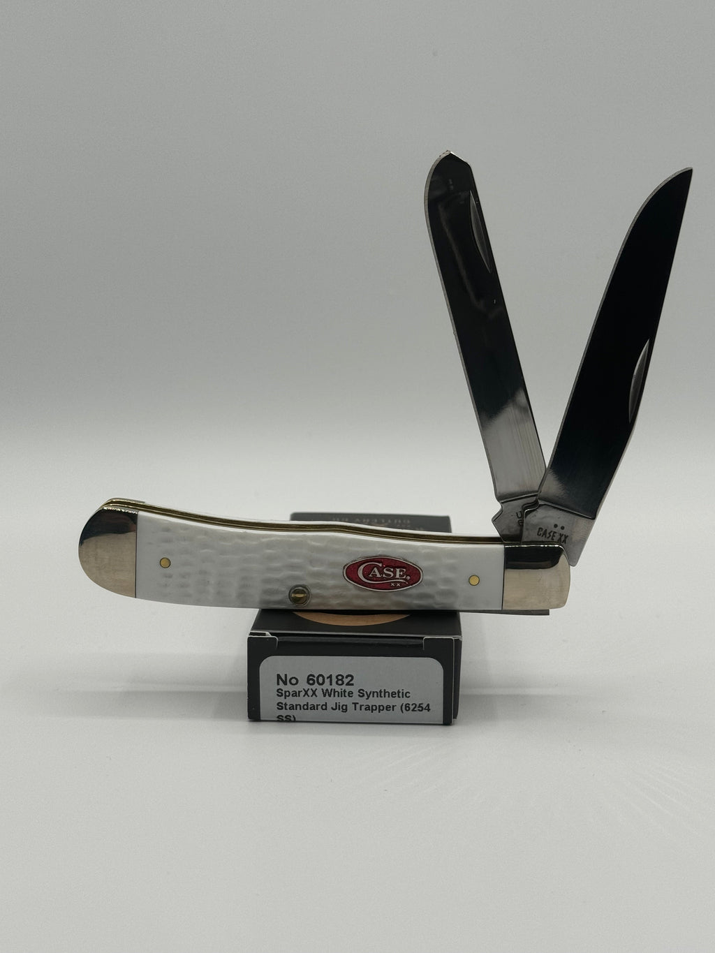 Pigeon Roost Knives Case XX SparXX Trapper pocket knife with white jigged synthetic handle and two stainless blades