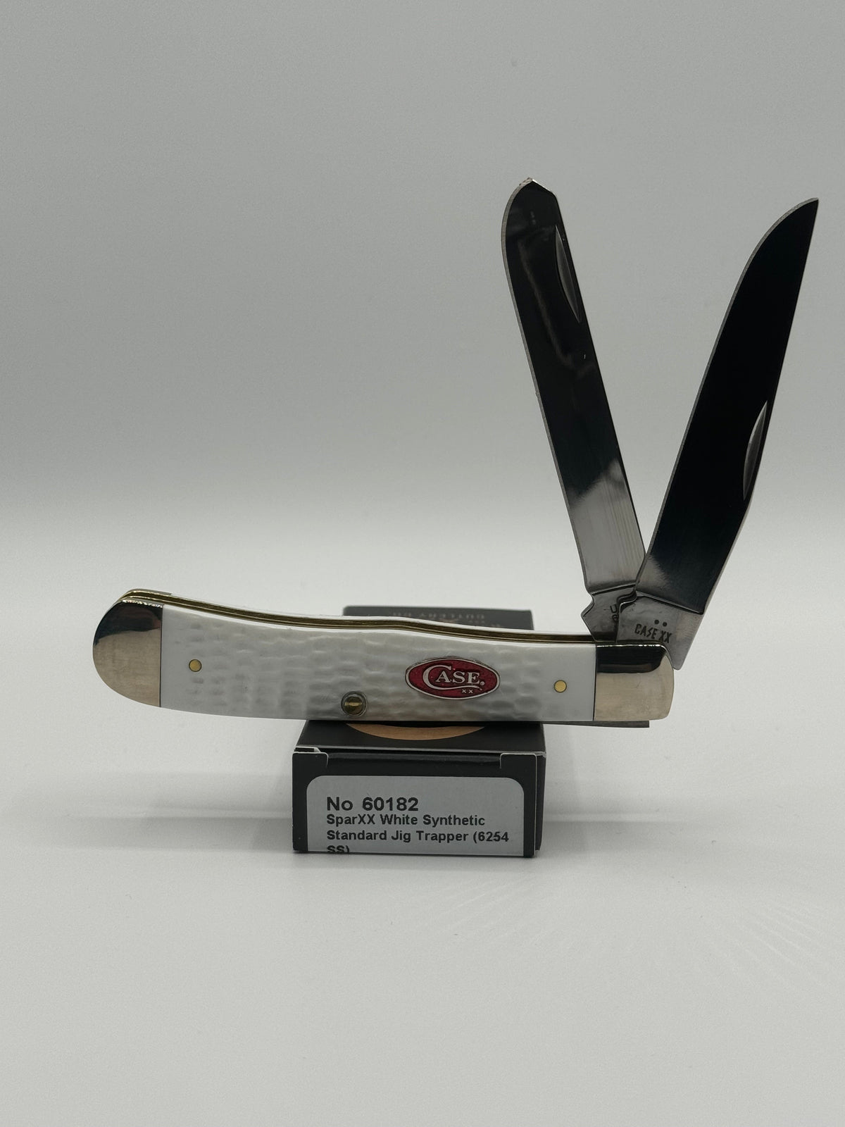 Pigeon Roost Knives Case XX SparXX Trapper pocket knife with white jigged synthetic handle and two stainless blades