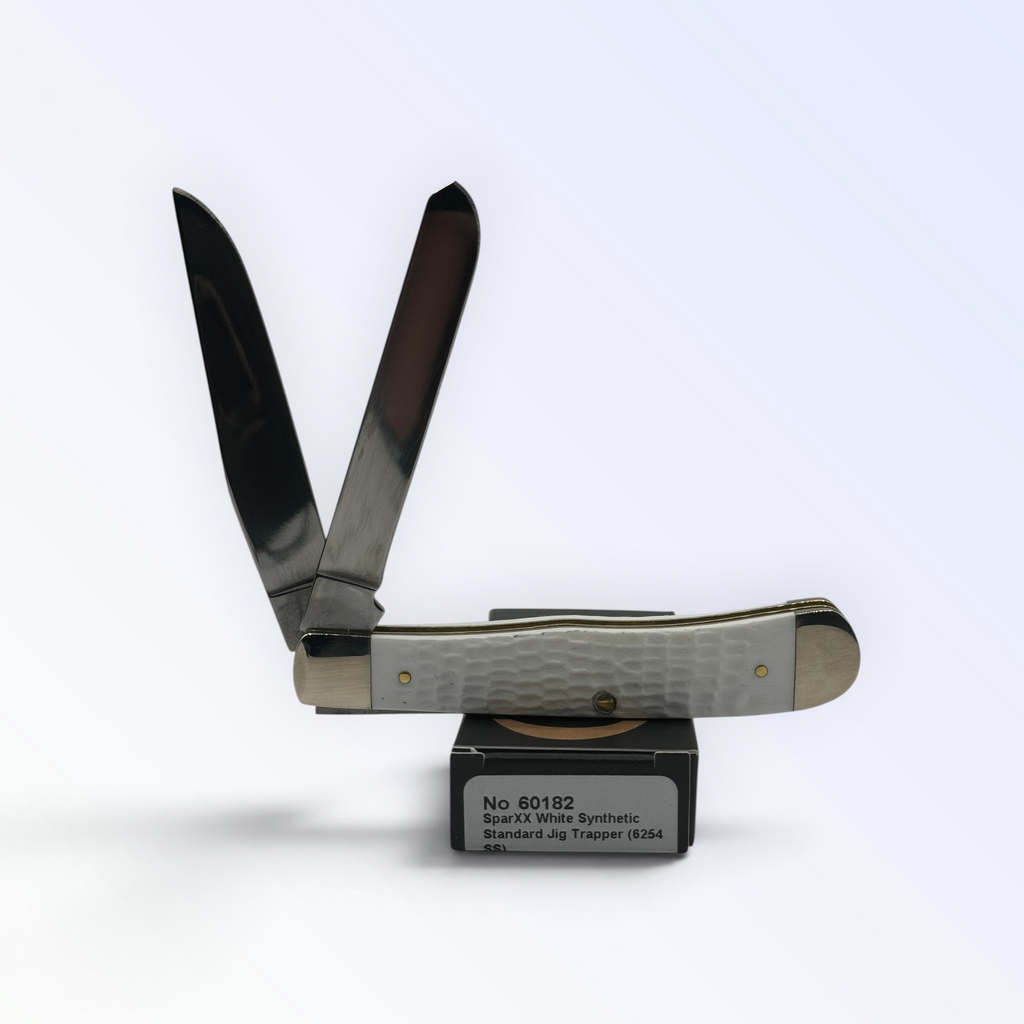 Pigeon Roost Knives Case XX SparXX Trapper pocket knife with white jigged synthetic handle and two stainless blades.
