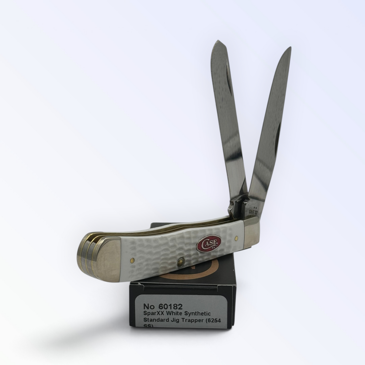 Pigeon Roost Knives Case XX SparXX Trapper pocket knife with white jigged synthetic handle and two stainless blades.