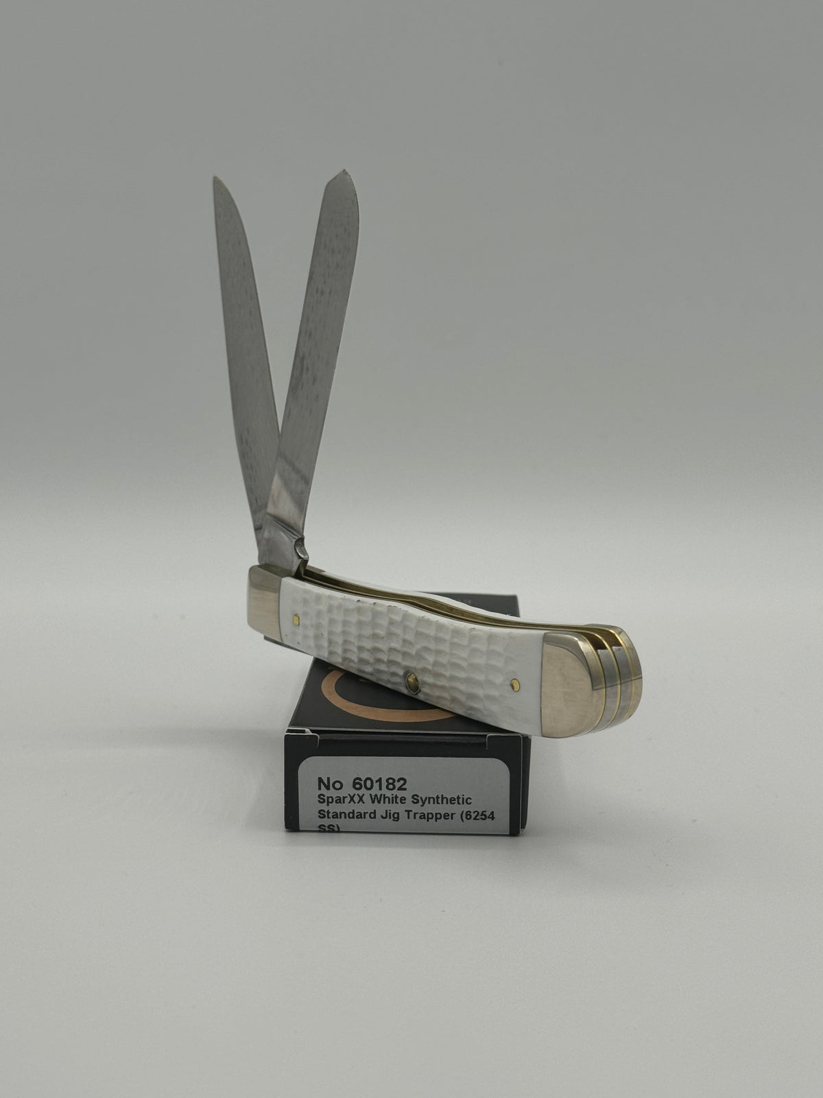 Pigeon Roost Knives Case XX SparXX Trapper pocket knife with white jigged synthetic handle and two stainless blades