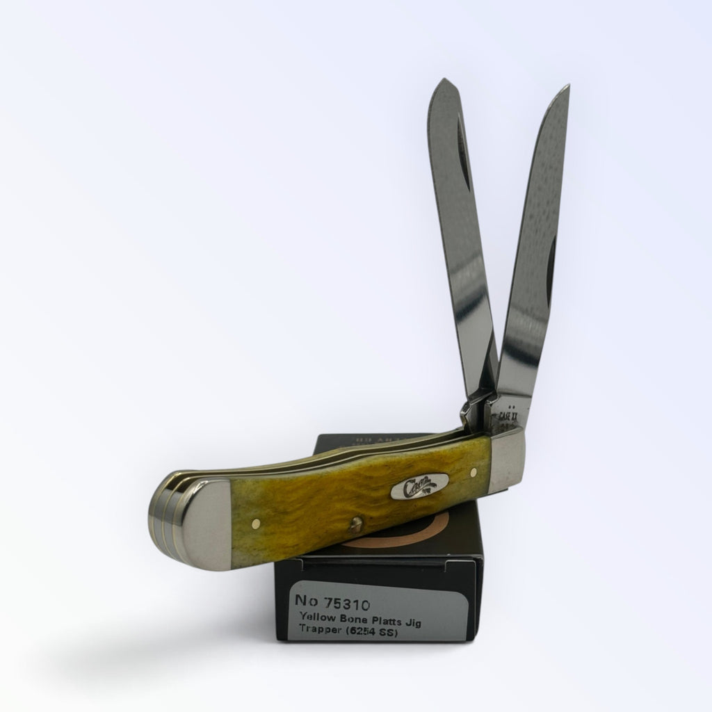 Pigeon Roost Knives Case XX 75310 Trapper pocket knife with yellow jigged bone handle and two stainless steel blades.