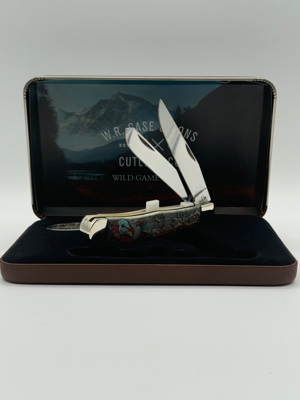 Pigeon Roost Knives Case XX Wild Game Series Trapper knife with smooth bone handle and stainless steel blades in a tin