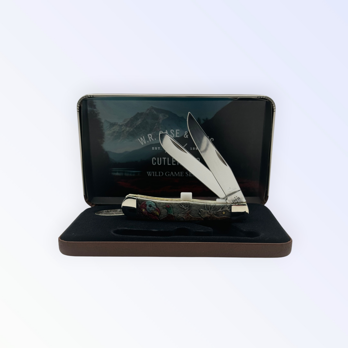 Pigeon Roost Knives Case XX Wild Game Series Trapper knife with smooth bone handle in a decorative display gift tin.