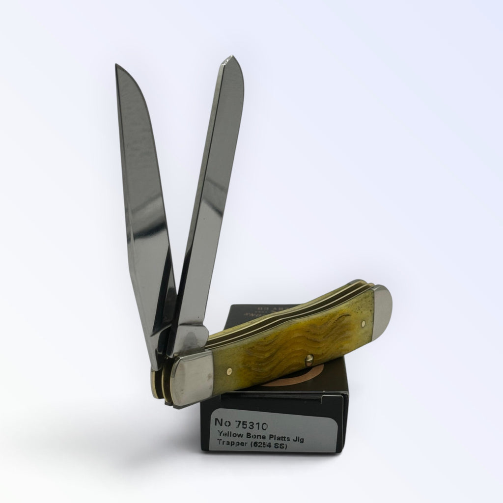 Pigeon Roost Knives Case XX Trapper pocket knife with yellow jigged bone handle and two stainless steel blades.