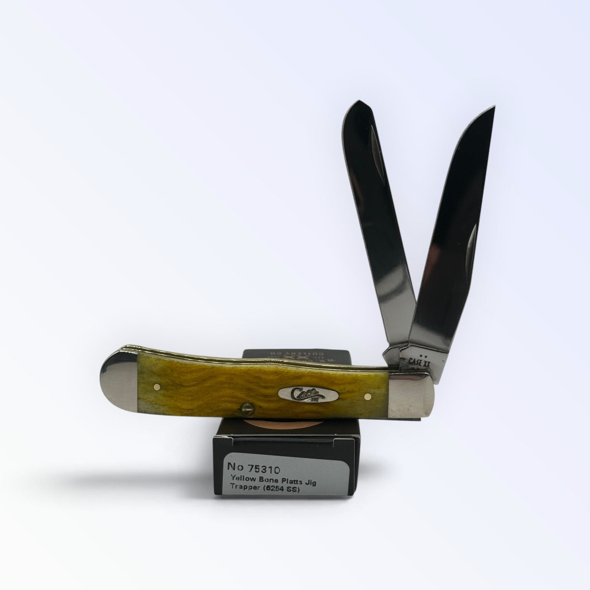Pigeon Roost Knives Case XX 75310 Trapper pocket knife with yellow jigged bone handle and two stainless steel blades.