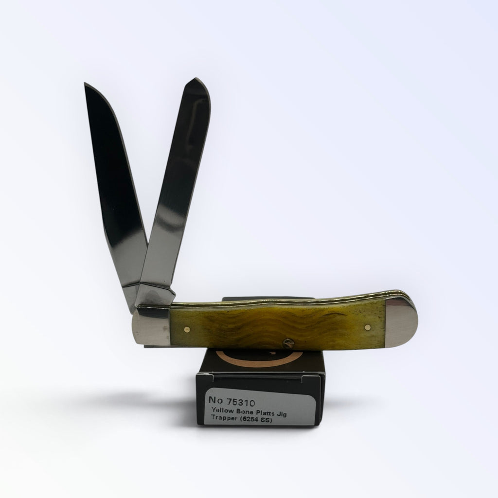 Pigeon Roost Knives Case XX Trapper pocket knife with yellow Platts jigged bone handle and two stainless steel blades.