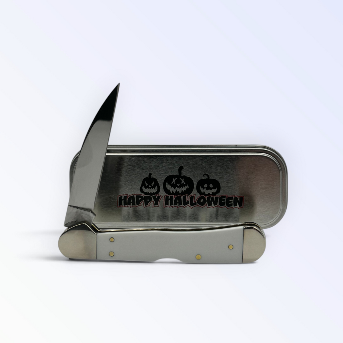 Pigeon Roost Knives Case XX Halloween Copperlock knife with white handle and matching festive metal gift tin