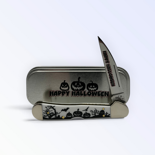 Pigeon Roost Knives Case XX Halloween Copperlock pocket knife with white handle and graveyard scene in a metal tin