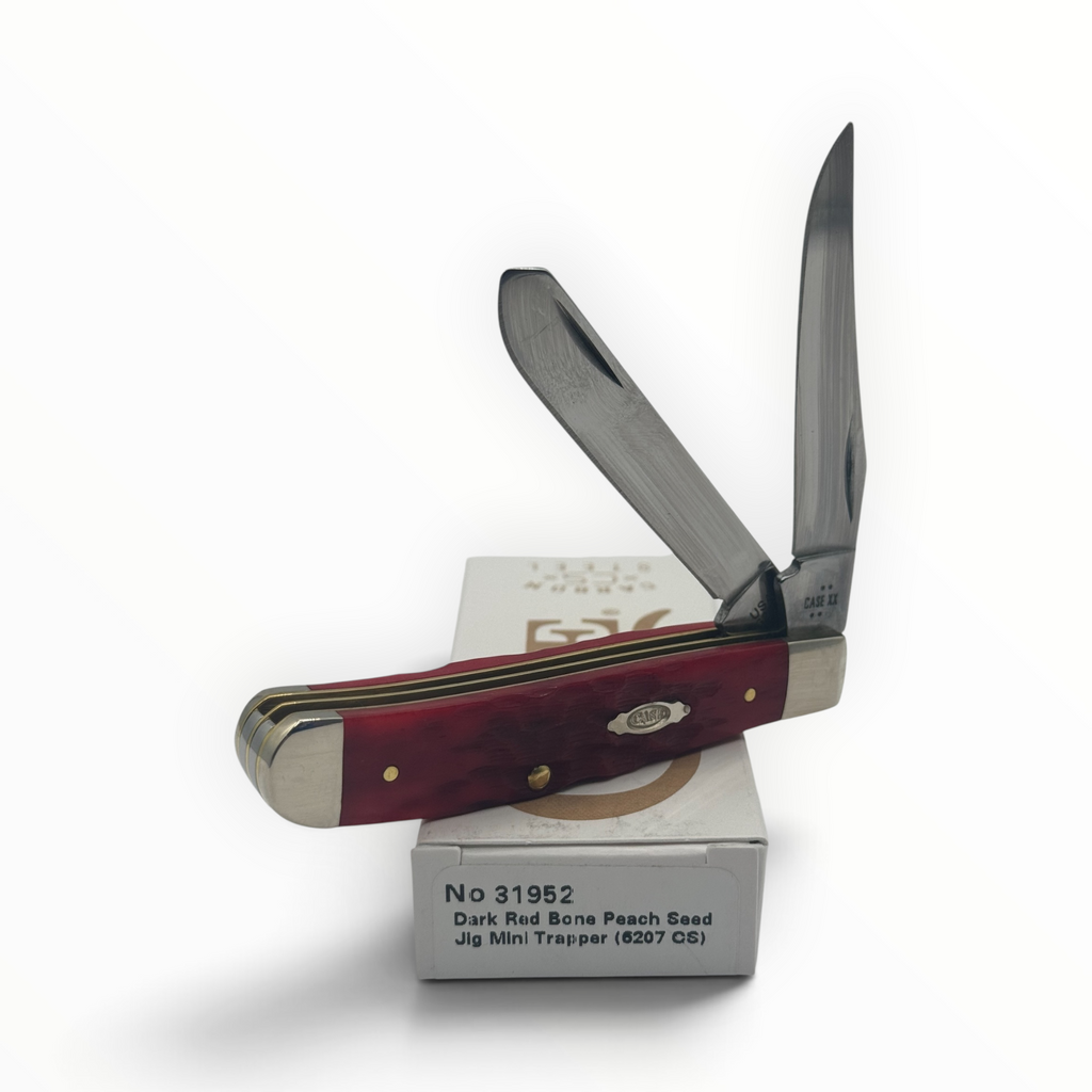 Pigeon Roost Knives Case XX Mini Trapper with dark red peach seed jigged bone handle and two carbon steel blades