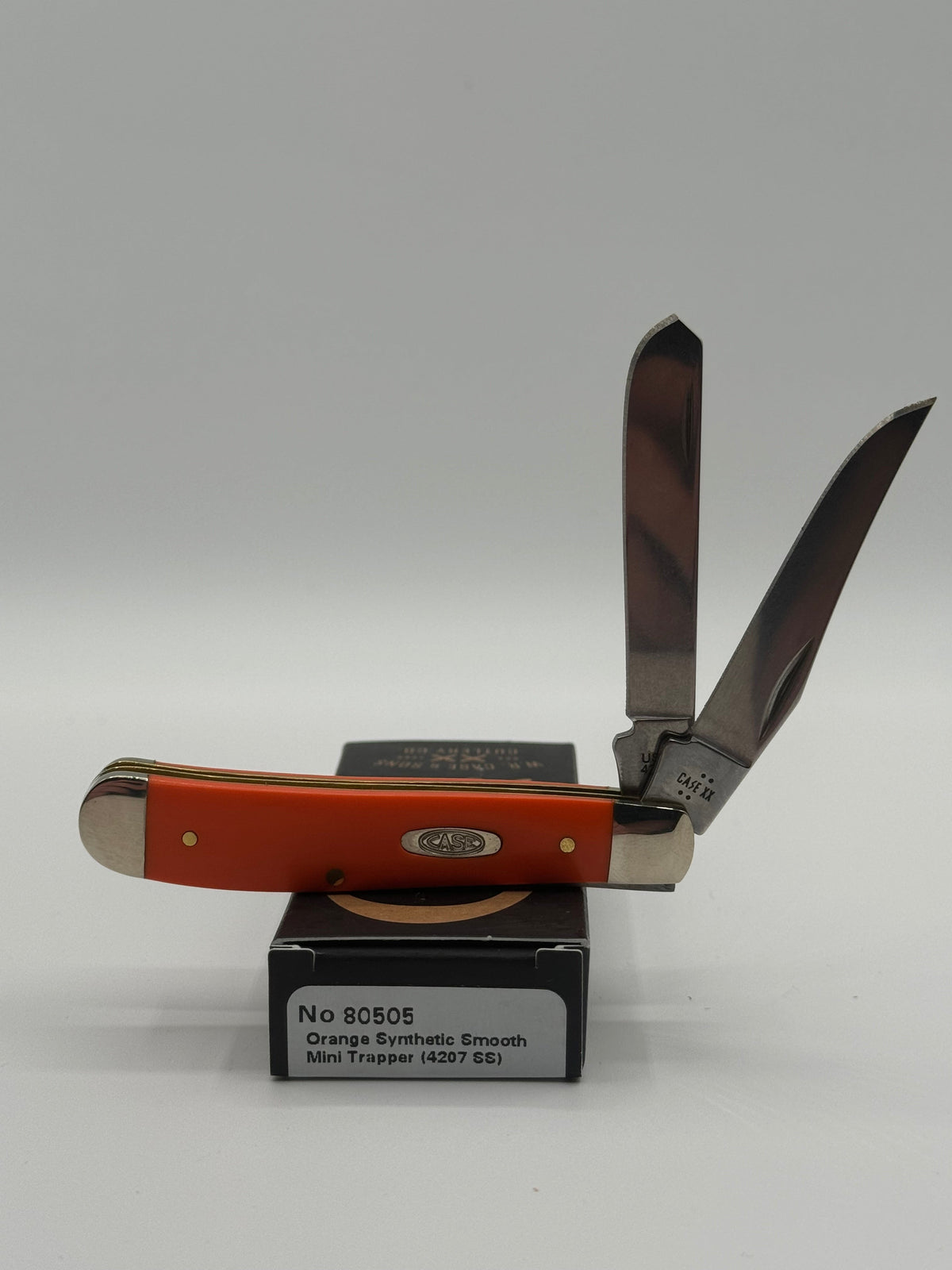 Pigeon Roost Knives Case XX Mini Trapper with smooth orange synthetic handle and two stainless steel blades