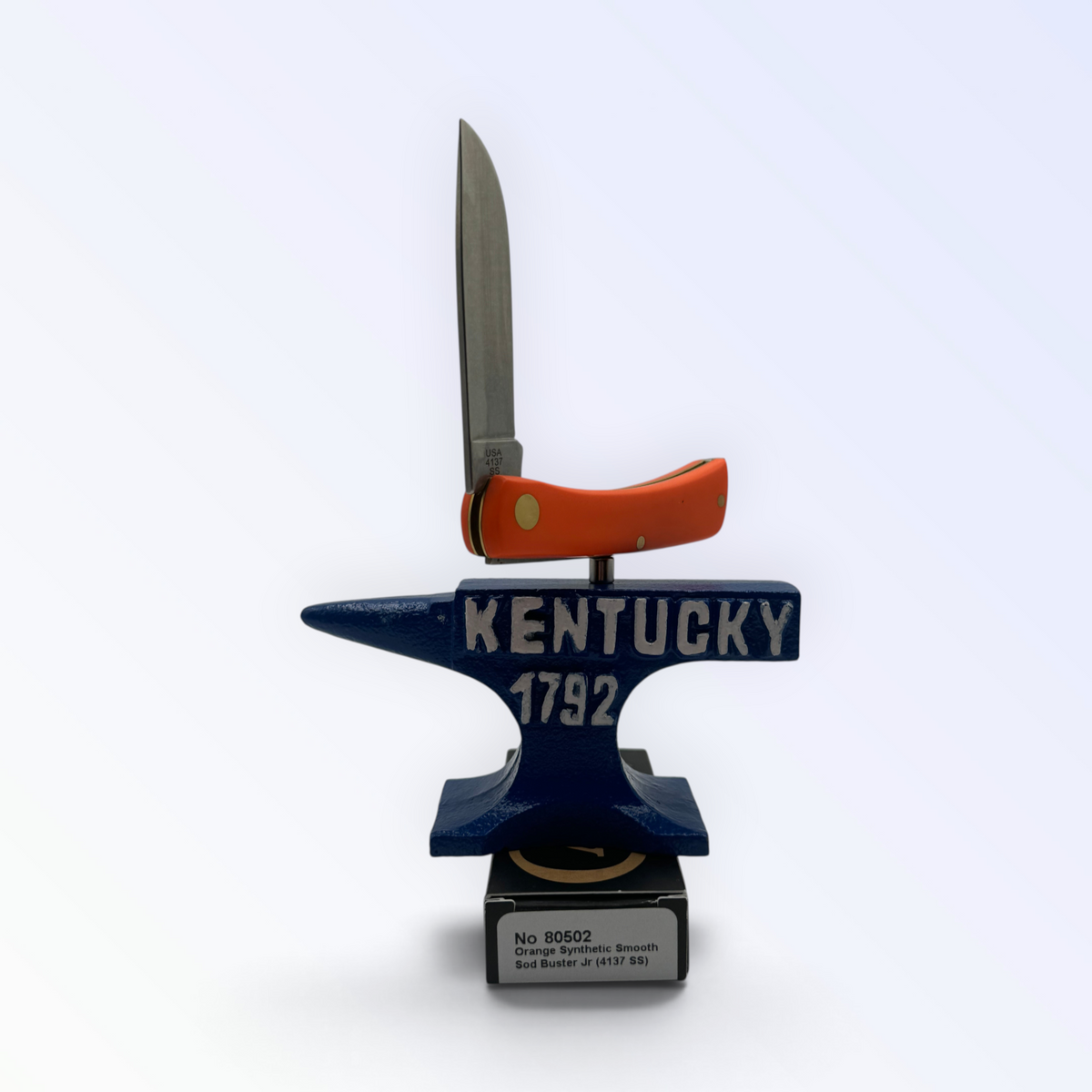 Pigeon Roost Knives Case XX Sod Buster Jr pocket knife with a smooth orange synthetic handle on a Kentucky anvil