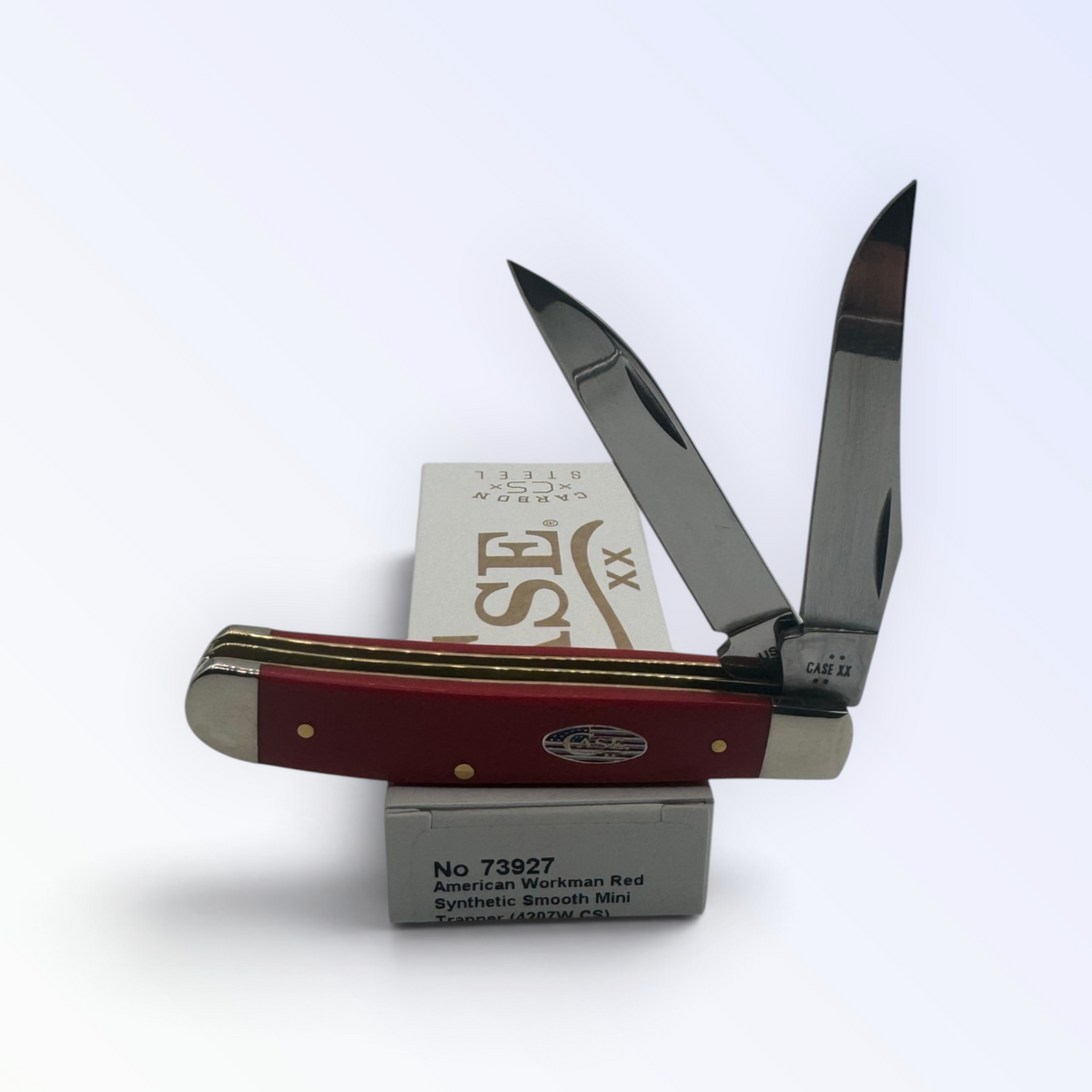 Pigeon Roost Knives Case XX American Workman Mini Trapper with smooth red synthetic handle and carbon steel blades.