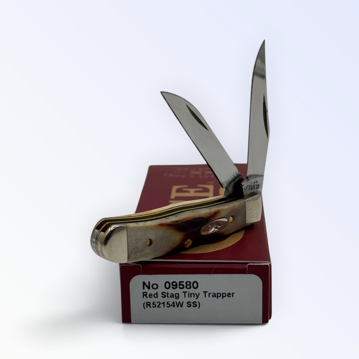 Pigeon Roost Knives Case XX Red Stag Tiny Trapper pocket knife with dual stainless steel blades and stag handle